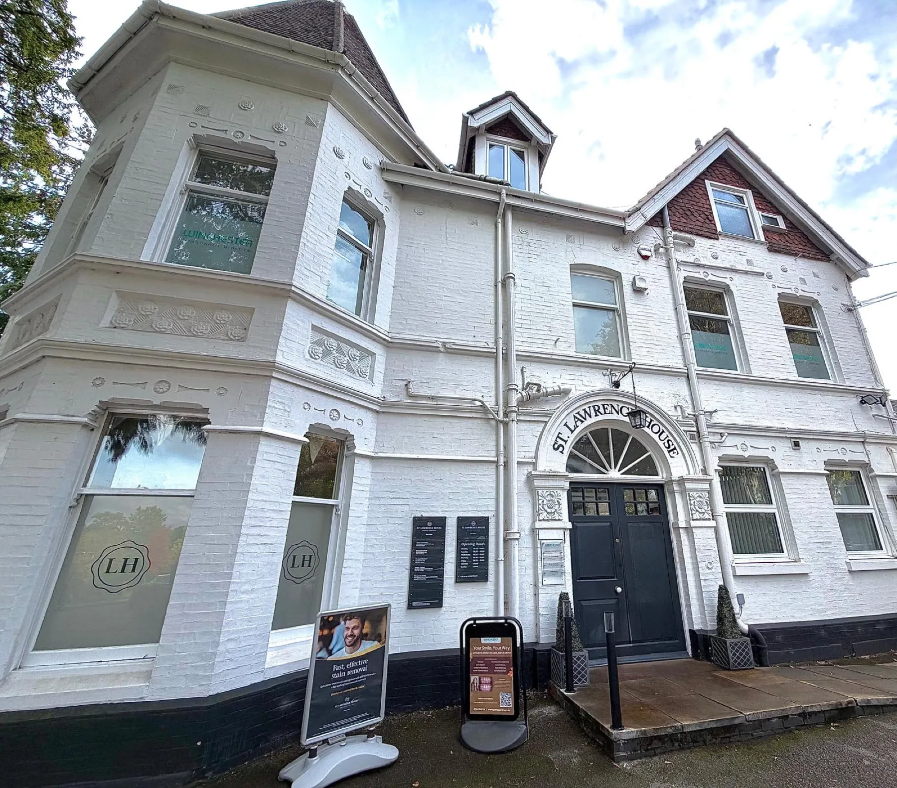 St Lawrence House, the white Victorian building where the practice is, with its black front door