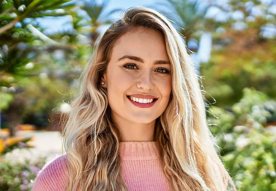 Smiling woman outdoors in a garden