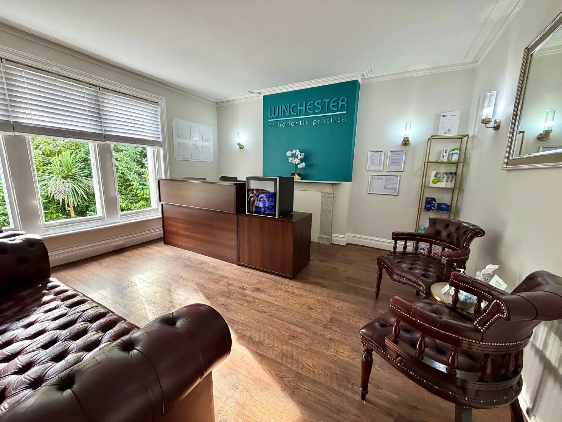 The practice reception, with leather Chesterfield seating and the Winchester Orthodontic Practice sign