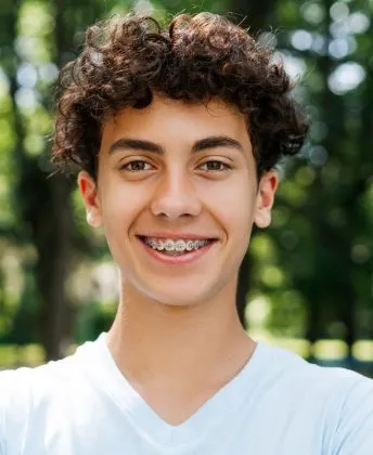Teenager smiling with metal braces